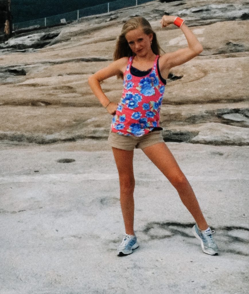Girl flexing arm muscles 